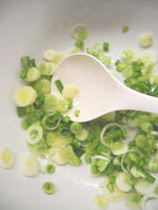 Sliced spring onions with olive oil